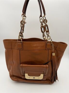 Brown Leather Tote Bag with Chain Handles & Tassel Accent